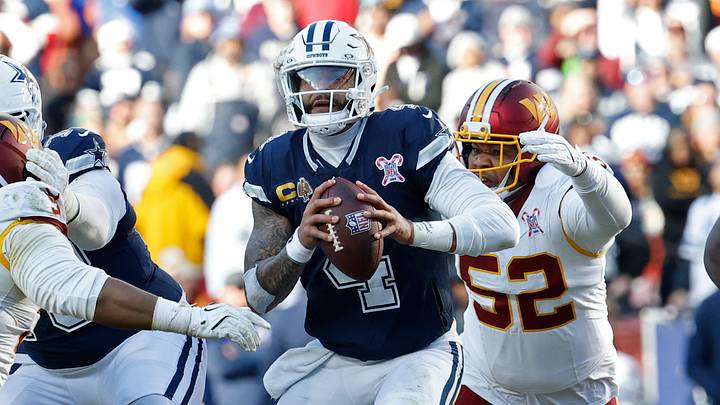 Dallas Cowboys quarterback Dak Prescott avoids a rush from Washington Commanders defenders Jer'Zhan Newton andPreston Smith Dallas Cowboys quarterback Dak Prescott avoids a rush from Washington Commanders defenders Jer'Zhan Newton andPreston Smith