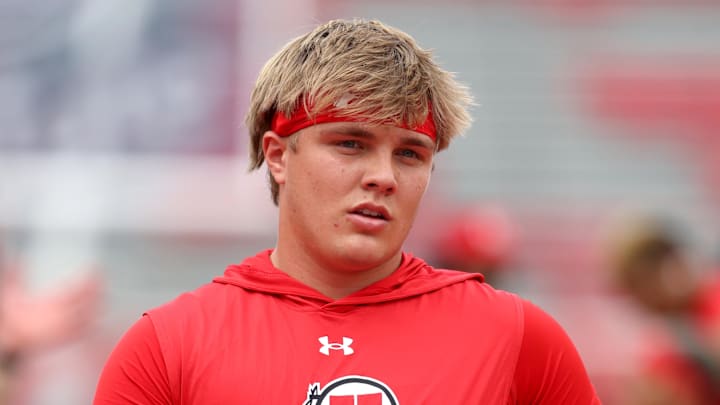 Sep 6, 2025; Salt Lake City, Utah, USA; Utah Utes quarterback Isaac Wilson (11) warms up before the game against the Cal Poly Mustangs at Rice-Eccles Stadium.