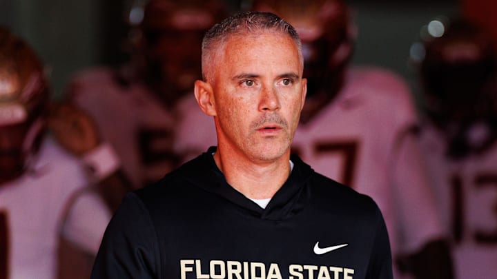 Nov 29, 2025; Gainesville, Florida, USA; Florida State Seminoles head coach Mike Norvell walks out of the tunnel before a game against the Florida Gators at Ben Hill Griffin Stadium. Mandatory Credit: Matt Pendleton-Imagn Images