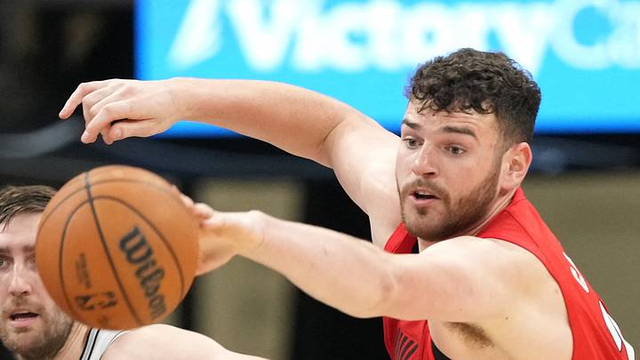 Portland Trail Blazers center Donovan Clingan reaches for a loose ball. Portland Trail Blazers center Donovan Clingan reaches for a loose ball.