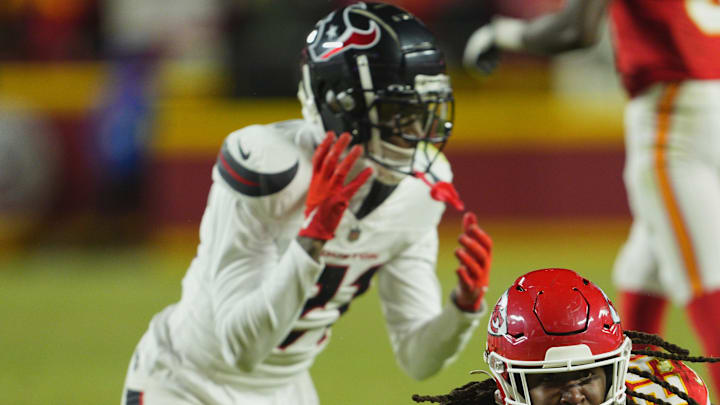 Jan 18, 2025; Kansas City, Missouri, USA; Kansas City Chiefs running back Kareem Hunt (29) reacts after running the ball against Houston Texans safety Calen Bullock (21) during the fourth quarter of a 2025 AFC divisional round game at GEHA Field at Arrowhead Stadium. Mandatory Credit: Jay Biggerstaff-Imagn Images
