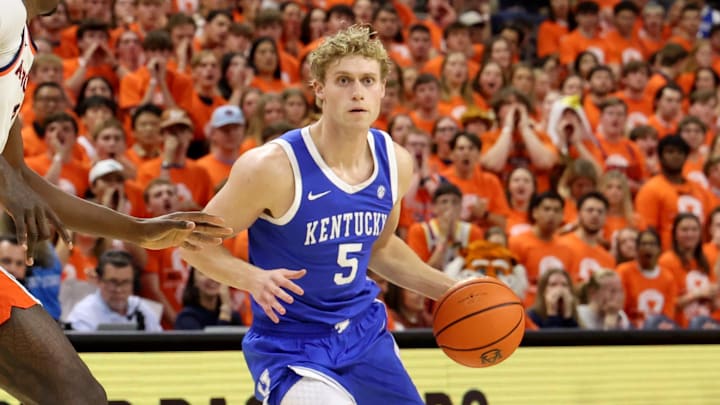 Feb 21, 2026; Auburn, Alabama, USA;  Kentucky Wildcats guard Collin Chandler (5) runs a play as Auburn Tigers forward Keshawn Murphy (3) defends during the first half at Neville Arena. Mandatory Credit: John Reed-Imagn Images