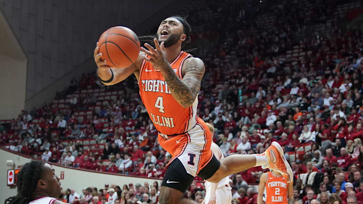 Jan 14, 2025; Bloomington, Indiana, USA; Indiana Hoosiers forward Mackenzie Mgbako (21) fouls Illinois Fighting Illini guard Kylan Boswell (4) during the second half at Simon Skjodt Assembly Hall. Mandatory Credit: Robert Goddin-Imagn Images Jan 14, 2025; Bloomington, Indiana, USA; Indiana Hoosiers forward Mackenzie Mgbako (21) fouls Illinois Fighting Illini guard Kylan Boswell (4) during the second half at Simon Skjodt Assembly Hall. Mandatory Credit: Robert Goddin-Imagn Images