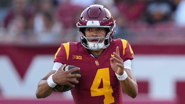 Aug 30, 2025; Los Angeles, California, USA; Southern California Trojans quarterback Husan Longstreet (4) carries the ball against the Missouri State Bears in the second half at United Airlines Field at Los Angeles Memorial Coliseum. Mandatory Credit: Kirby Lee-Imagn Images