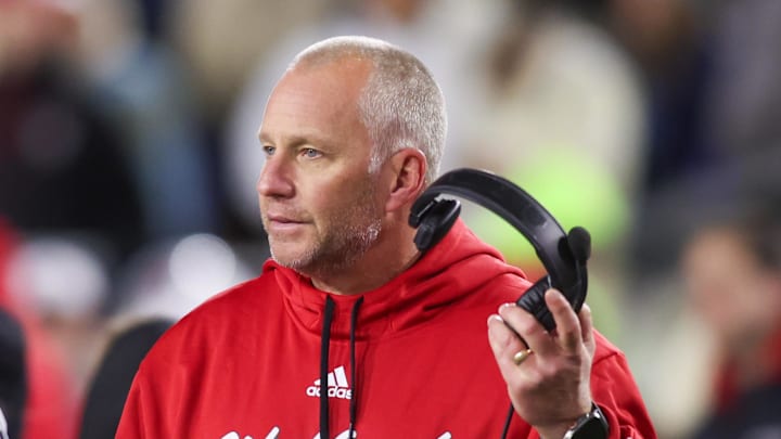 Nov 21, 2024; Atlanta, Georgia, USA; North Carolina State Wolfpack head coach Dave Doeren talks to a referee against the Georgia Tech Yellow Jackets in the fourth quarter at Bobby Dodd Stadium at Hyundai Field. Mandatory Credit: Brett Davis-Imagn Images Nov 21, 2024; Atlanta, Georgia, USA; North Carolina State Wolfpack head coach Dave Doeren talks to a referee against the Georgia Tech Yellow Jackets in the fourth quarter at Bobby Dodd Stadium at Hyundai Field. Mandatory Credit: Brett Davis-Imagn Images