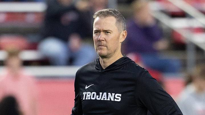 Oct 24, 2026; Madison, Wisconsin, USA;  USC Trojans head coach Lincoln Riley watches his team during warmups before the game against the Wisconsin Badgers at Camp Randall Stadium.  Mandatory Credit: Anthony Wahl-Imagn Images