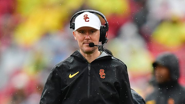 Nov 15, 2025; Los Angeles, California, USA; Southern California Trojans head coach Lincoln Riley watches game action against the Iowa Hawkeyes during the first half at the Los Angeles Memorial Coliseum. Mandatory Credit: Gary A. Vasquez-Imagn Images