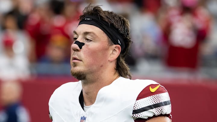 Sep 29, 2024; Glendale, Arizona, USA; Washington Commanders tight end John Bates (87) against the Arizona Cardinals at State Farm Stadium. Mandatory Credit: Mark J. Rebilas-Imagn Images