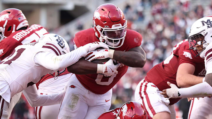 Arkansas Razorbacks running back Braylen Russell (0) rushes for a touchdown during the fourth quarter against the Mississippi State Bulldogs at Razorback Stadium.