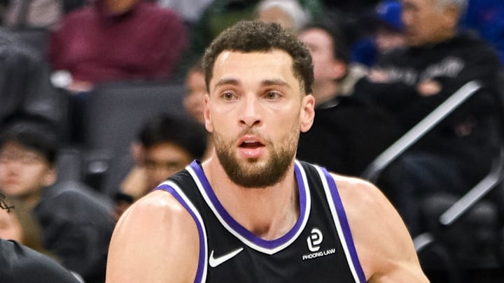 Feb 4, 2026; Sacramento, California, USA; Sacramento Kings guard Zach LaVine (8) dribbles past Memphis Grizzlies guard Kentavious Caldwell-Pope (3) during the third quarter at Golden 1 Center. Mandatory Credit: Ed Szczepanski-Imagn Images