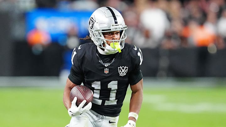 Nov 24, 2024; Paradise, Nevada, USA; Las Vegas Raiders wide receiver Tre Tucker (11) gains yardage against the Denver Broncos during the fourth quarter at Allegiant Stadium. Mandatory Credit: Stephen R. Sylvanie-Imagn Images
