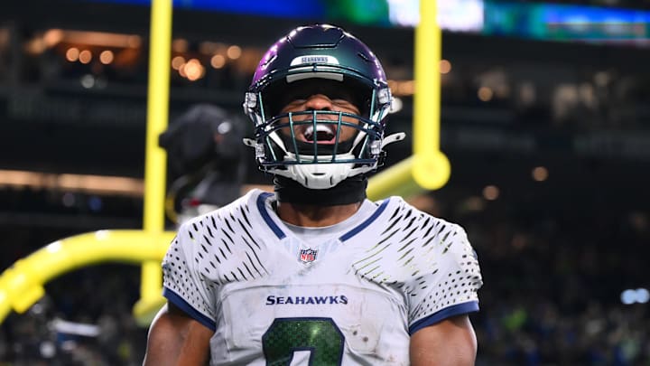 Dec 18, 2025; Seattle, Washington, USA; Seattle Seahawks running back Kenneth Walker III (9) celebrates after scoring a touchdown against the Los Angeles Rams in the second half at Lumen Field. Mandatory Credit: Steven Bisig-Imagn Images