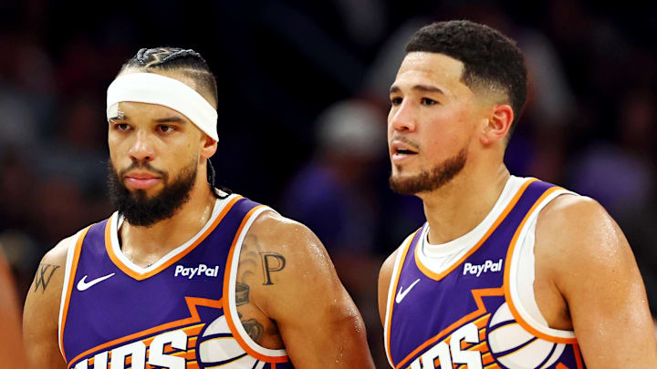 Oct 22, 2025; Phoenix, Arizona, USA; Phoenix Suns guard Devin Booker (1) and forward Dillon Brooks (3) during the second half against the Sacramento Kings at the Mortgage Matchup Center. Mandatory Credit: Mark J. Rebilas-Imagn Images