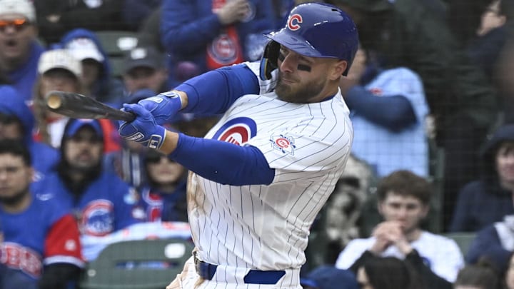Mar 26, 2026; Chicago, Illinois, USA;  Chicago Cubs first baseman Michael Busch (29) hits a RBI single against the Washington Nationals during the third inning at Wrigley Field. Mandatory Credit: Matt Marton-Imagn Images
