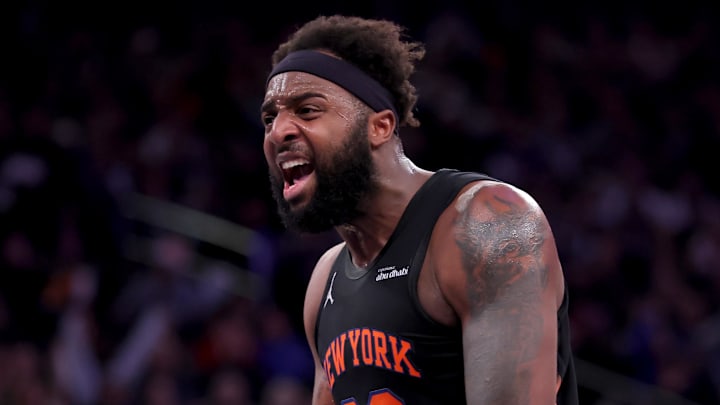 Dec 19, 2025; New York, New York, USA; New York Knicks center Mitchell Robinson (23) reacts after a dunk against the Philadelphia 76ers during the second quarter at Madison Square Garden. Mandatory Credit: Brad Penner-Imagn Images