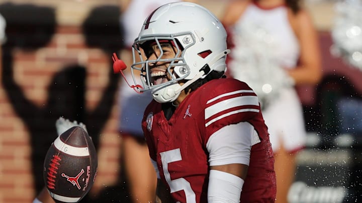 Oklahoma wide receiver Isaiah Sategna III celebrates after scoring a touchdown against Kent State.