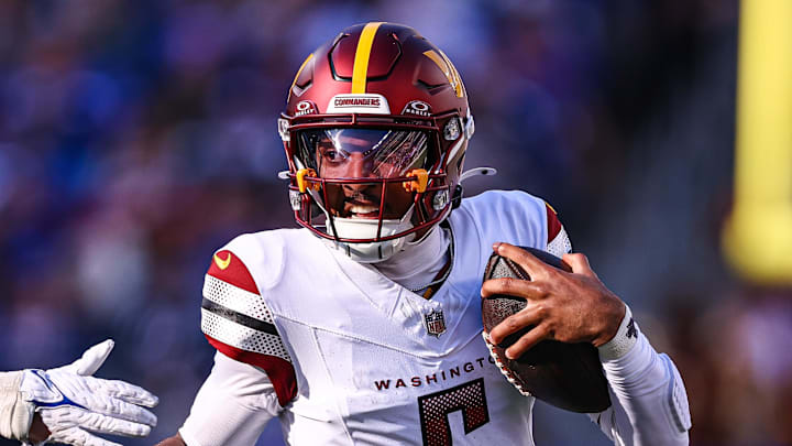 Nov 3, 2024; East Rutherford, New Jersey, USA; Washington Commanders quarterback Jayden Daniels (5) scrambles away from New York Giants linebacker Micah McFadden (41) during the first half at MetLife Stadium. Mandatory Credit: Vincent Carchietta-Imagn Images Nov 3, 2024; East Rutherford, New Jersey, USA; Washington Commanders quarterback Jayden Daniels (5) scrambles away from New York Giants linebacker Micah McFadden (41) during the first half at MetLife Stadium. Mandatory Credit: Vincent Carchietta-Imagn Images