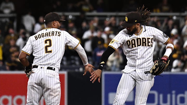 San Diego Padres right fielder Fernando Tatis Jr. (right) and shortstop Xander Bogaerts (2) celebrate after defeating the Cincinnati Reds at Petco Park on May 1, 2023.