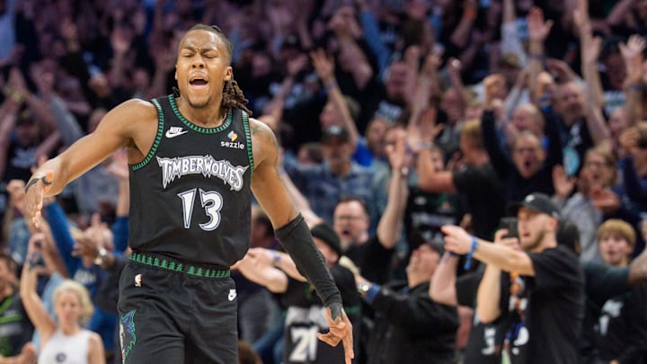 Apr 25, 2026; Minneapolis, Minnesota, USA; Minnesota Timberwolves guard Ayo Dosunmu (13) celebrates with fans after making a three-point shot against the Denver Nuggets in the fourth quarter at Target Center. Mandatory Credit: Matt Blewett-Imagn Images