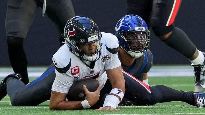 Indianapolis Colts defensive tackle DeForest Buckner (99) and Houston Texans quarterback C.J. Stroud (7) Indianapolis Colts defensive tackle DeForest Buckner (99) and Houston Texans quarterback C.J. Stroud (7)
