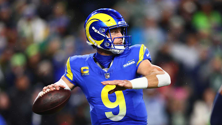 Dec 18, 2025; Seattle, Washington, USA; Los Angeles Rams quarterback Matthew Stafford (9) passes against the Seattle Seahawks in the first half at Lumen Field. Mandatory Credit: Kevin Ng-Imagn Images