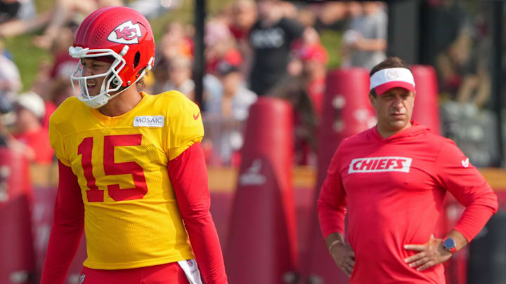 Jul 26, 2024; Kansas City, MO, USA; Kansas City Chiefs quarterback Patrick Mahomes (15) steps to the line as general manager Brett Veach watches in the background during training camp at Missouri Western State University. Mandatory Credit: Denny Medley-Imagn Images