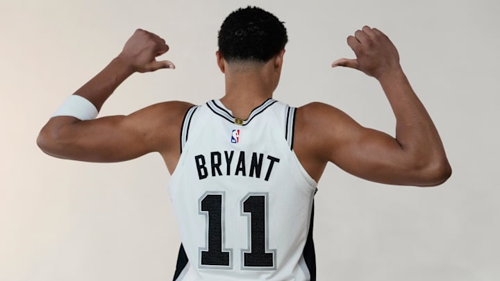 Sep 29, 2025; San Antonio, TX, USA; San Antonio Spurs forward Carter Bryant (11) poses for photos during Media Day at Victory Capital Performance Center in San Antonio. Sep 29, 2025; San Antonio, TX, USA; San Antonio Spurs forward Carter Bryant (11) poses for photos during Media Day at Victory Capital Performance Center in San Antonio.