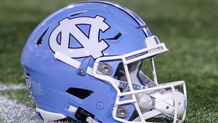 Oct 28, 2023; Atlanta, Georgia, USA; A detailed view of a North Carolina Tar Heels helmet on the field before a game against the Georgia Tech Yellow Jackets at Bobby Dodd Stadium at Hyundai Field. Mandatory Credit: Brett Davis-Imagn Images