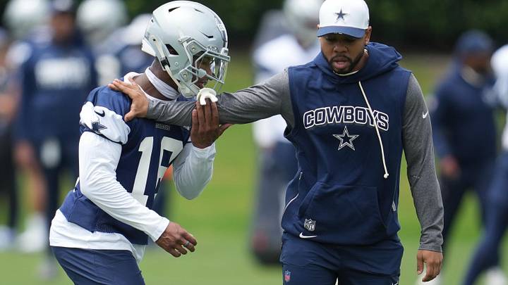 Dallas Cowboys cornerback Caleb Downs is coached through a drill with defensive coordinator Christian Parker. Dallas Cowboys cornerback Caleb Downs is coached through a drill with defensive coordinator Christian Parker.