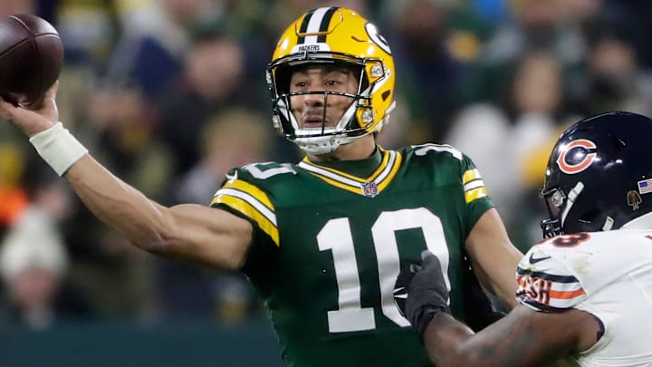 Green Bay Packers quarterback Jordan Love (10) throws under pressure from Chicago Bears defensive tackle Justin Jones.