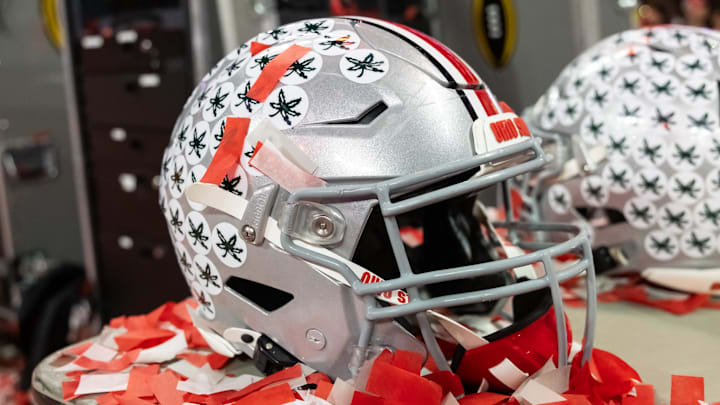 Jan 20, 2025; Atlanta, GA, USA; Detailed view of confetti with an Ohio State Buckeyes helmet after winning the CFP National Championship college football game at Mercedes-Benz Stadium. Mandatory Credit: Mark J. Rebilas-Imagn Images
