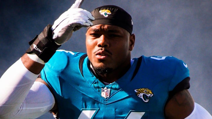 Jacksonville Jaguars defensive end Travon Walker (44) enters the stadium before an NFL football game at EverBank Stadium, Sunday, Dec. 14, 2025, in Jacksonville, Fla.