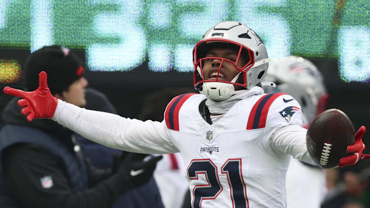 Dec 28, 2025; East Rutherford, New Jersey, USA; New England Patriots safety Jaylinn Hawkins (21) celebrates an interception against the New York Jets during the first quarter of the game at MetLife Stadium. Mandatory Credit: Vincent Carchietta-Imagn Images