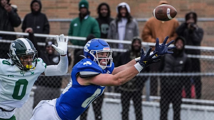Novi Detroit Catholic Central‘s Jack Janda stretches out but fails to pull in the pass, while being covered by Cass Tech’s Lamont Wilcoxson in the fourth quarter during MHSAA semifinals at Troy Athens high school on Saturday, Nov. 23, 2024.