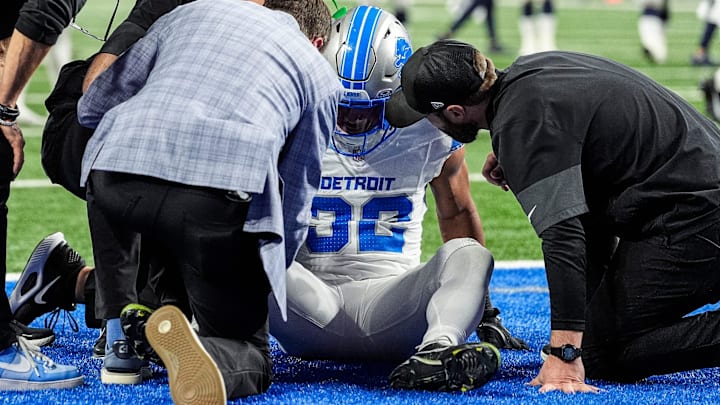 Detroit Lions head coach Dan Campbell, left, and staff check on the injury of safety Brian Branch (32) during the second half at Ford Field in Detroit on Thursday, Dec. 4, 2025. Detroit Lions head coach Dan Campbell, left, and staff check on the injury of safety Brian Branch (32) during the second half at Ford Field in Detroit on Thursday, Dec. 4, 2025.