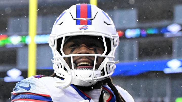 Dec 14, 2025; Foxborough, Massachusetts, USA; Buffalo Bills running back James Cook III (4) reacts after scoring a touchdown against the New England Patriots during the second half at Gillette Stadium. Mandatory Credit: Brian Fluharty-Imagn Images