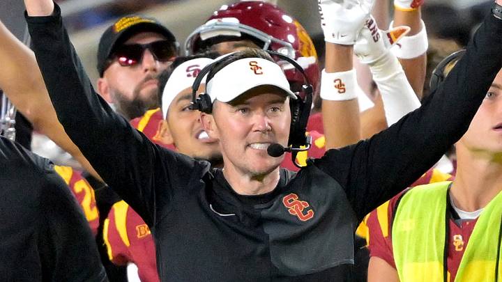 USC Trojans head coach Lincoln Riley and defensive line coach Shaun Nua celebrate on the sideline. USC Trojans head coach Lincoln Riley and defensive line coach Shaun Nua celebrate on the sideline.