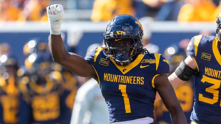 Oct 17, 2026; Morgantown, West Virginia, USA;  West Virginia Mountaineers cornerback Geimere Latimer (1) celebrates a defensive stop during the first quarter against the Cincinnati Bearcats at Milan Puskar Stadium.  Mandatory Credit: Ben Queen-Imagn Images