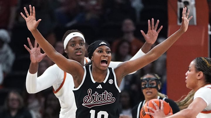 Texas Longhorns guard Jordan Lee (7) passes against Mississippi Rebels guard Jaylah Lampley (10) during the first quarter at Moody Center. 