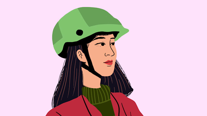 She’s probably trying to figure out how old her helmet is.