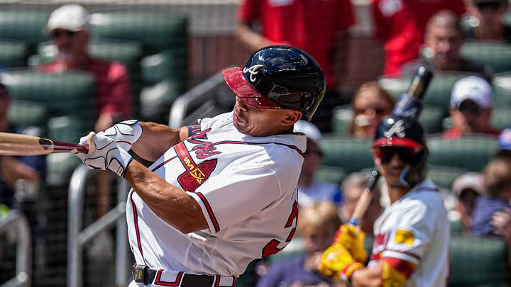 Sep 13, 2026; Cumberland, Georgia, USA; Atlanta Braves catcher Drake Baldwin (30) hits a sacrifice fly ball to drive in a run against the Philadelphia Phillies during the first inning at Truist Park. Mandatory Credit: Dale Zanine-Imagn Images
