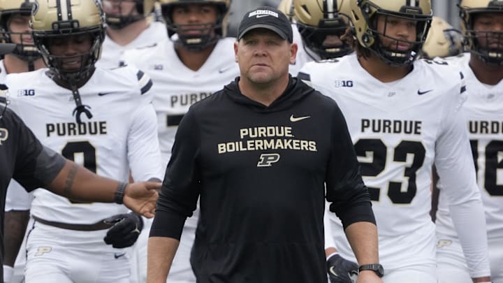 Purdue Boilermakers head coach Barry Odom takes the field 