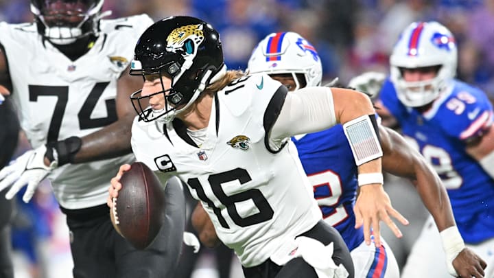 Sep 23, 2024; Orchard Park, New York, USA; Jacksonville Jaguars quarterback Trevor Lawrence (16) runs against the Buffalo Bills in the second quarter at Highmark Stadium. Mandatory Credit: Mark Konezny-Imagn Images
