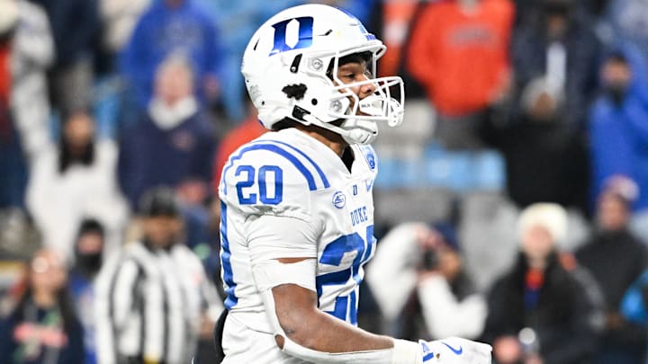 Dec 6, 2025; Charlotte, NC, USA; Duke Blue Devils running back Nate Sheppard (20) runs the ball for a touchdown in the second quarter against the Virginia Cavaliers during the 2025 ACC Championship game at Bank of America Stadium. Mandatory Credit: Bob Donnan-Imagn Images