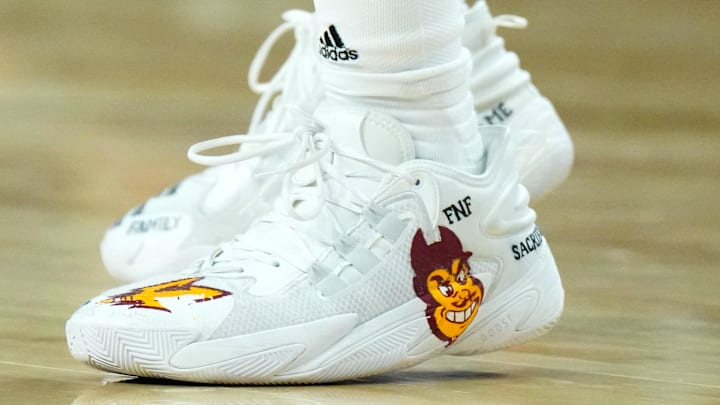 Mar 13, 2024; Las Vegas, NV, USA; The Adidas shoes with Arizona State Sun Devils mascot Sparky logo worn by Sun Devils guard Frankie Collins (1) in the second half against the Utah Utes at the T-Mobile Arena. Mandatory Credit: Kirby Lee-Imagn Images