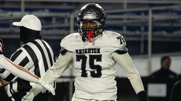 Brighton's Zahmar Tookes, right, gets a high-five from Alberto Atwell during the NYSPHSAA Class A semifinals Sunday, Nov. 30 at Cicero-North Syracuse High School.