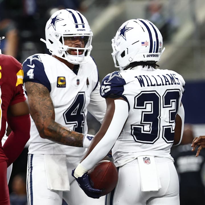Dallas Cowboys running back Javonte Williams celebrates a touchdown against the Washington Commanders with Dak Prescott