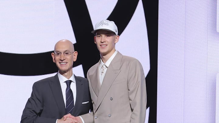 Jun 25, 2025; Brooklyn, NY, USA;  Egor Demin stands with NBA commissioner Adam Silver after being selected as the eighth pick by the Brooklyn Nets in the first round of the 2025 NBA Draft at Barclays Center. Mandatory Credit: Brad Penner-Imagn Images