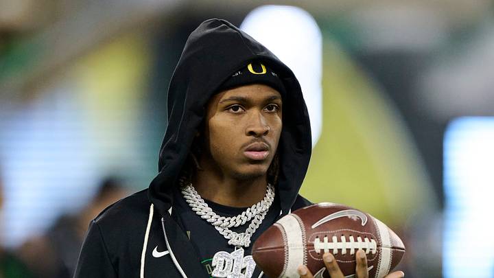 Nov 14, 2025; Eugene, Oregon, USA; Oregon Ducks wide receiver Dakorien Moore (1) watches teammates warm up before a game against the Minnesota Golden Gophers at Autzen Stadium. Mandatory Credit: Troy Wayrynen-Imagn Images Nov 14, 2025; Eugene, Oregon, USA; Oregon Ducks wide receiver Dakorien Moore (1) watches teammates warm up before a game against the Minnesota Golden Gophers at Autzen Stadium. Mandatory Credit: Troy Wayrynen-Imagn Images