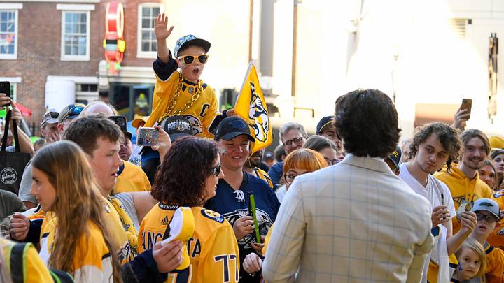 Oct 10, 2024; Nashville, Tennessee, USA;  Nashville Predators fan yells at Nashville Predators center Steven Stamkos (91) for an autograph during the Gold Carpet walk  at Bridgestone Arena. Mandatory Credit: Steve Roberts-Imagn Images